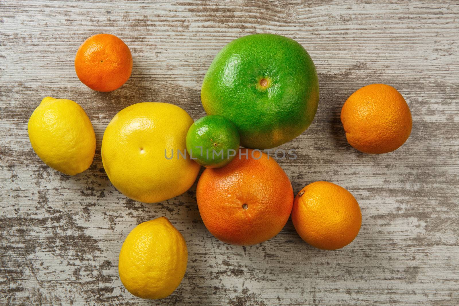 Background from citrus fruits - lemons oranges limes 