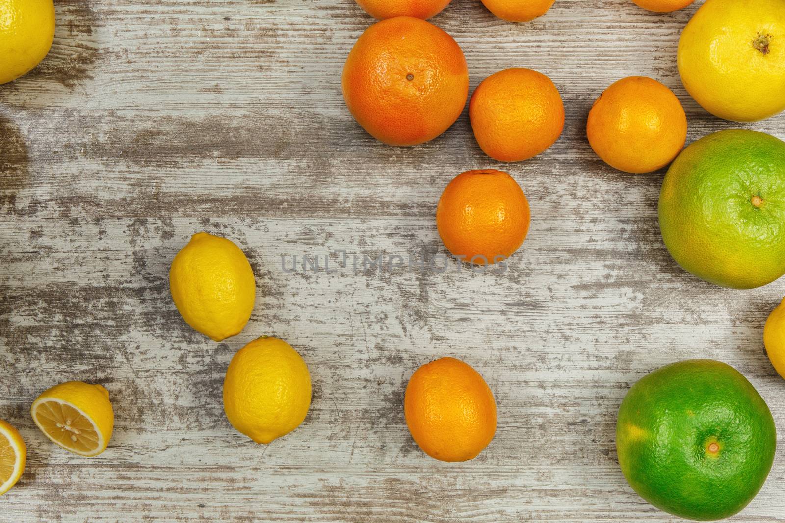 Background from citrus fruits - lemons oranges limes 