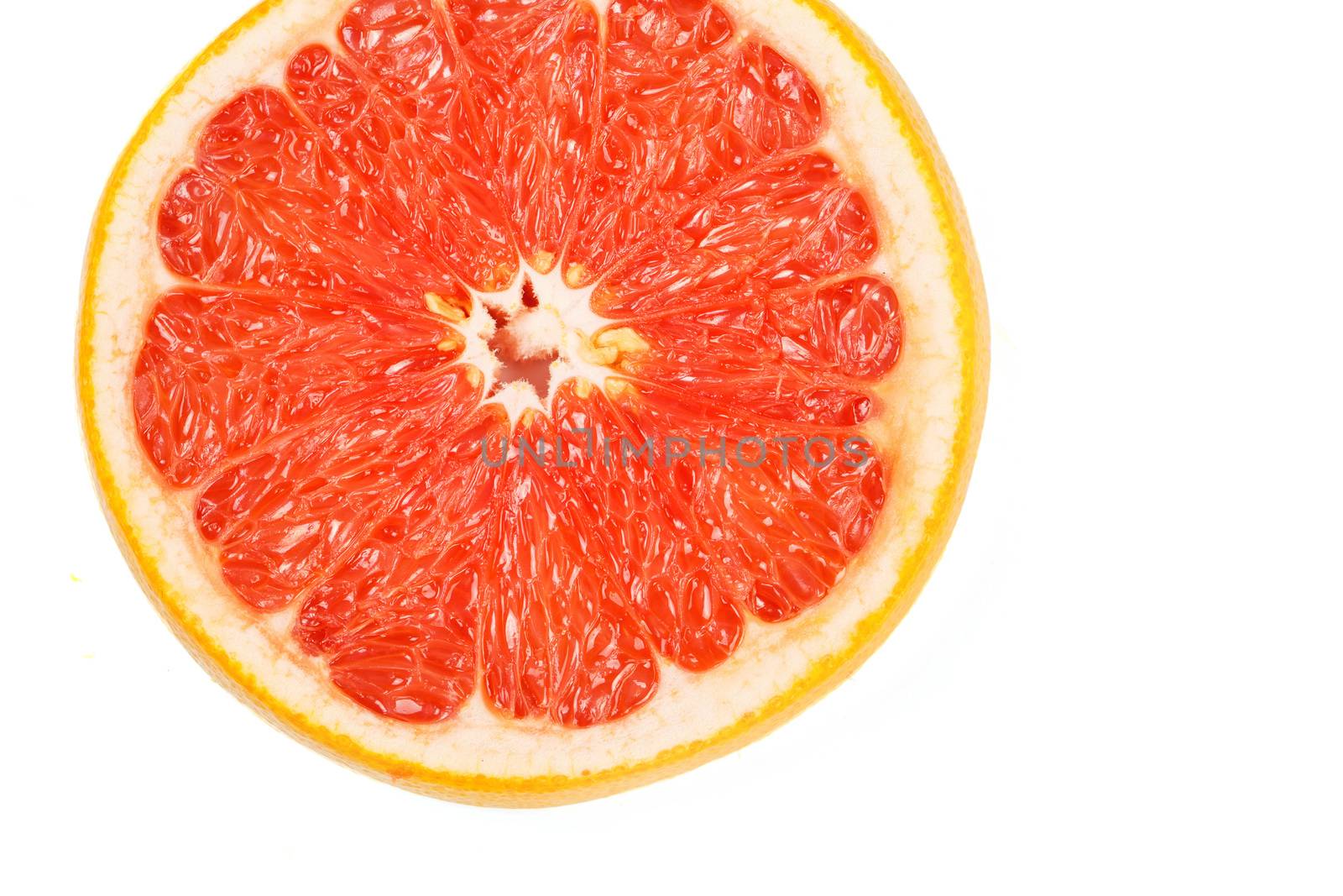 Slice a fresh juicy red round grapefruit