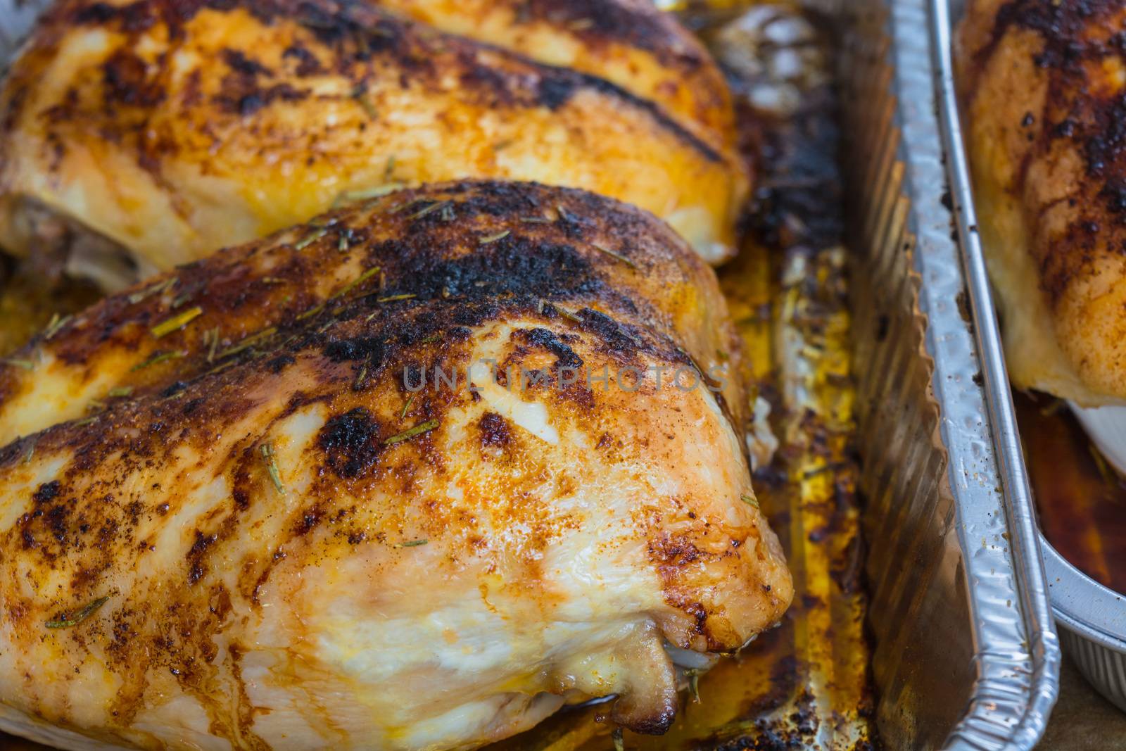 Duck breast fried finished in an aluminum tray fresh from the oven.