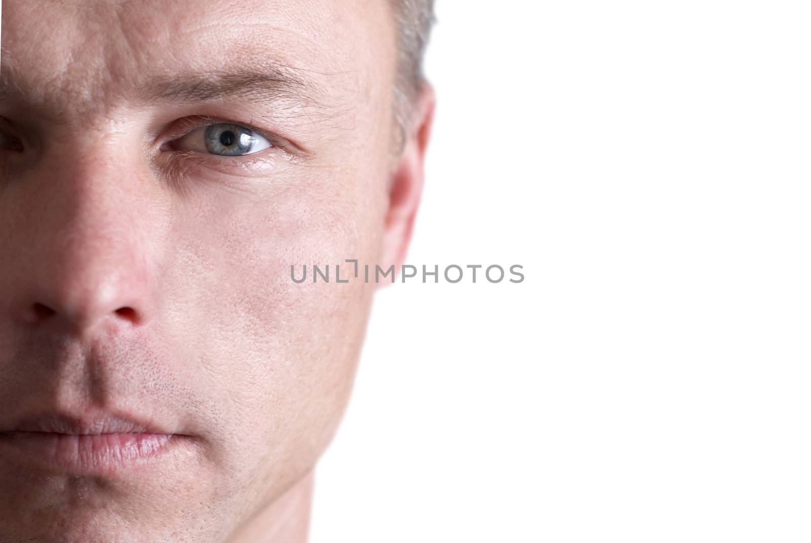 Handsome young man's face. Close up portrait on white background