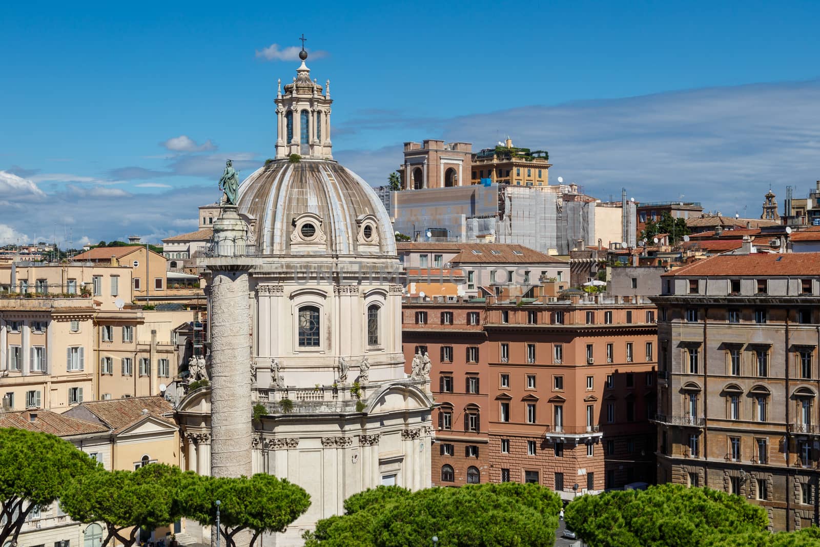 Close up view of ancient historical city of Rome with mausoleum and church dome, on cloudy blue sky background.