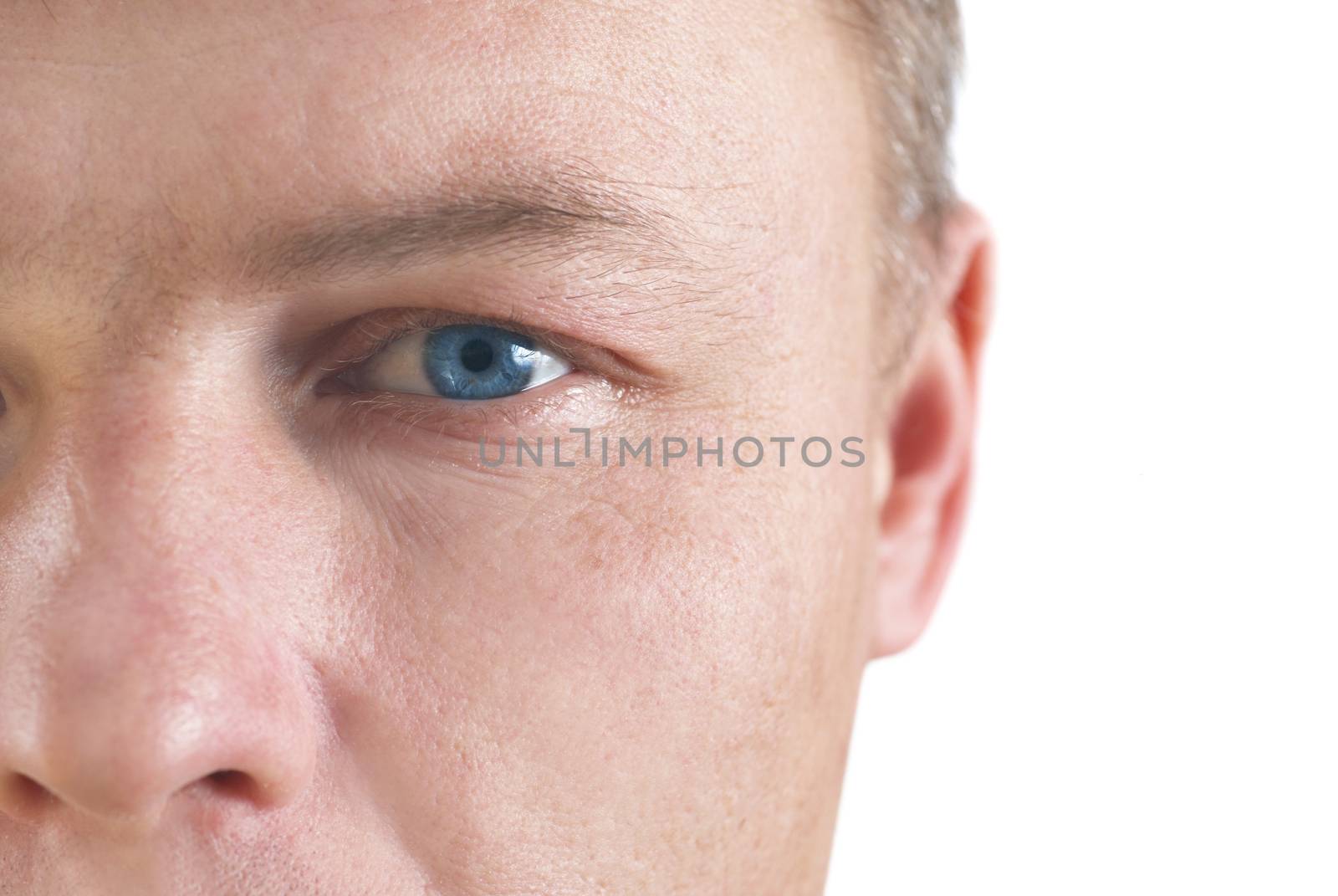 Handsome young man's face. Close up portrait on white background