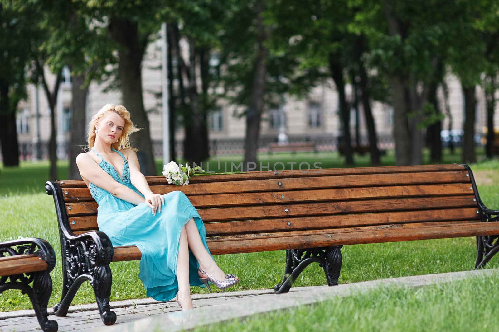 blond sexy girl on bench summer dress