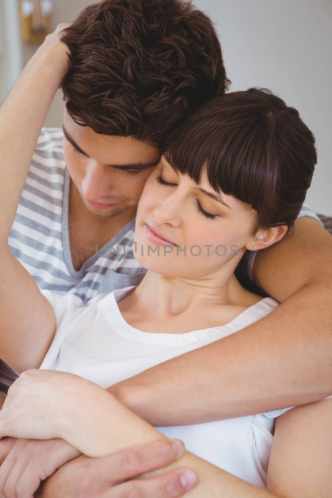 Romantic young couple cuddling