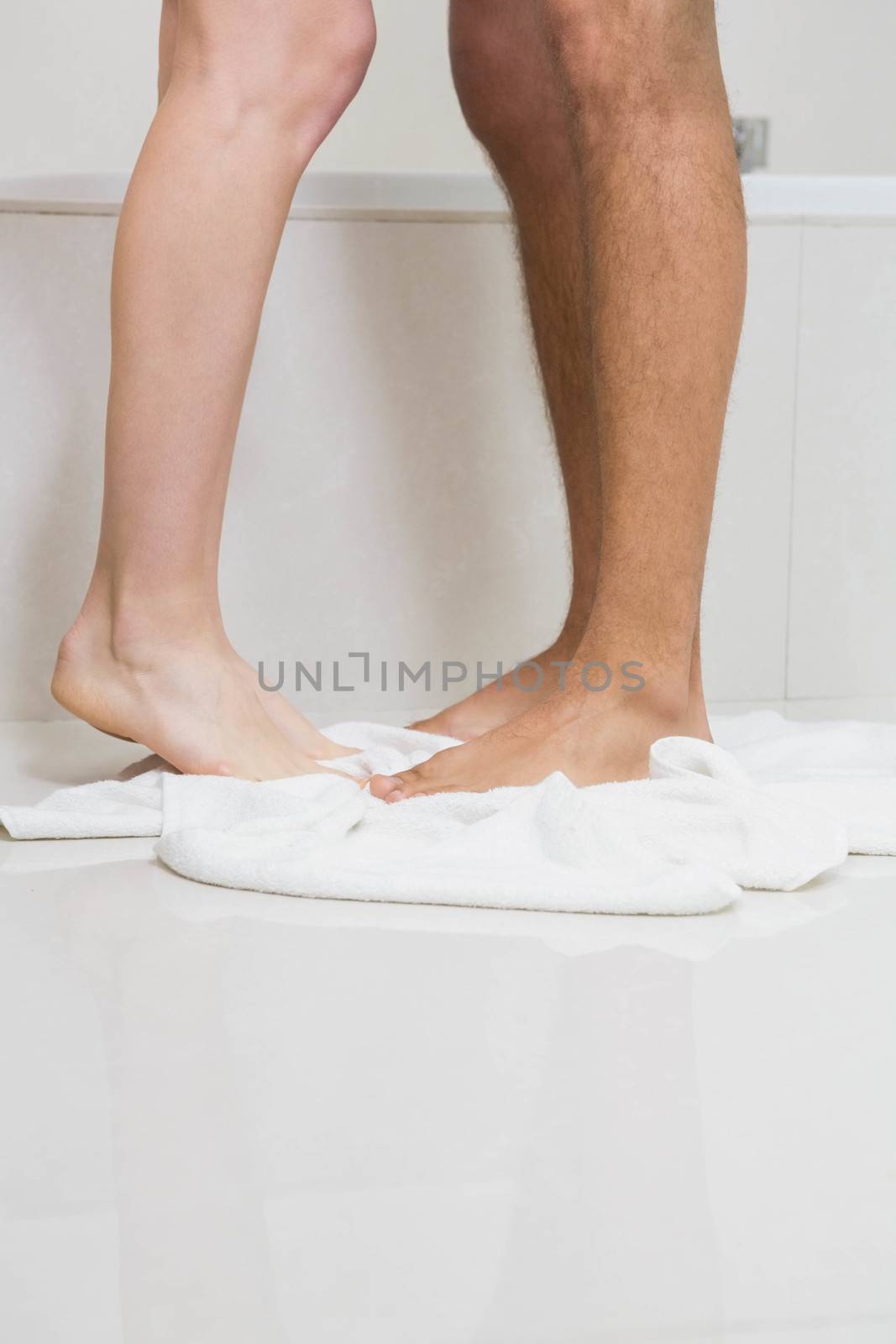 Young couple bathing together in bathtub in bathroom