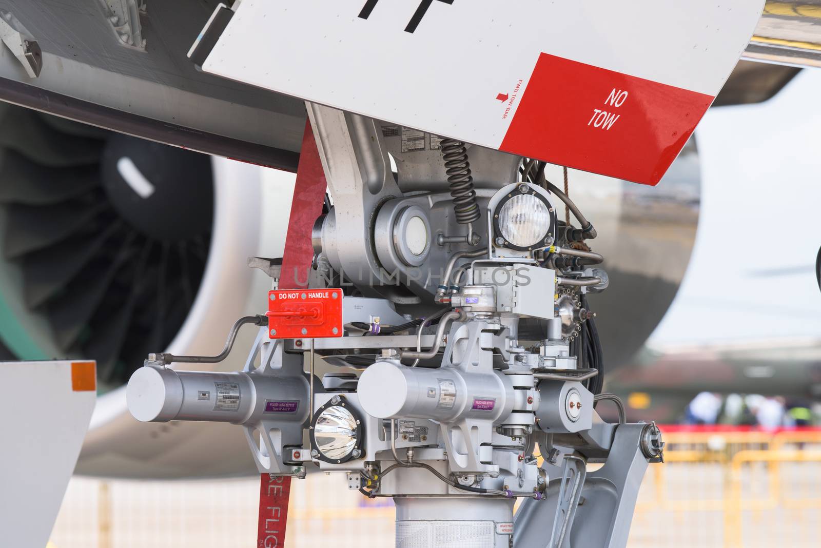 Singapore - February 16, 2016: Detail of the nose landing gear of an Airbus A380 at Singapore Airshow at Changi Exhibition Centre in Singapore.