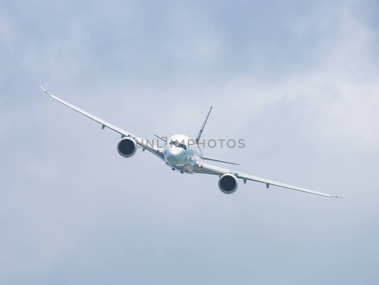 Singapore - February 14, 2016: Front view of Airbus A350 XWB during it’s performance at Singapore Airshow at Changi Exhibition Centre in Singapore.
