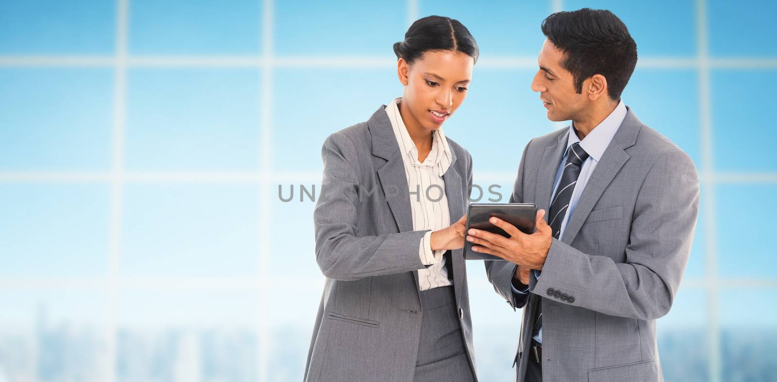 Composite image of business people discussing over digital tablet by Wavebreakmedia