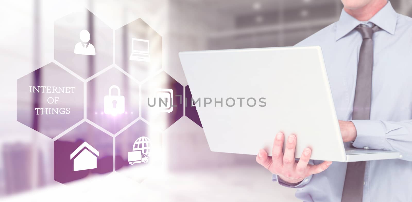 Composite image of businessman using a laptop by Wavebreakmedia