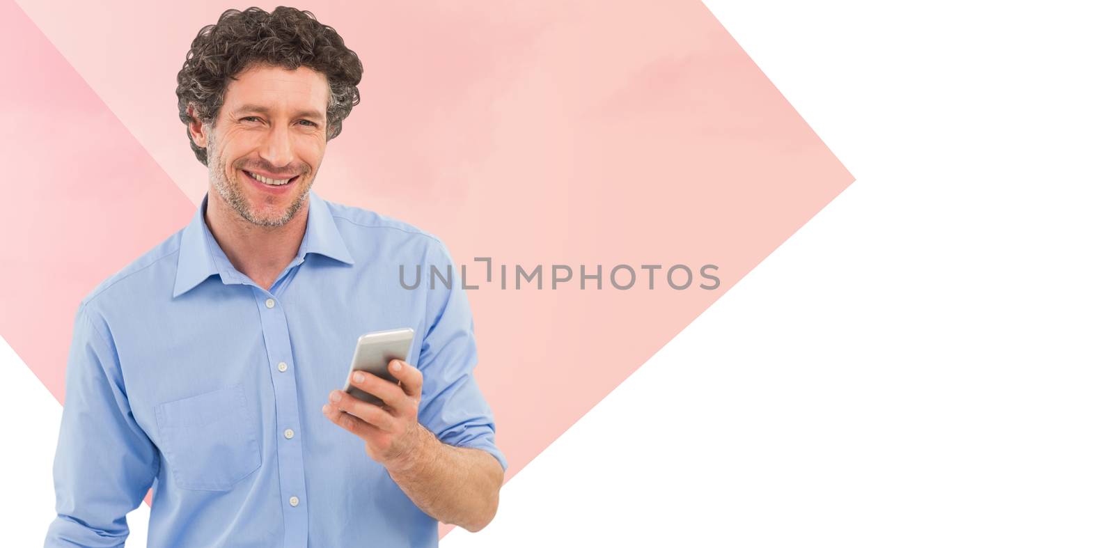 Businessman holding mobile phone over white background against landscape against white sky