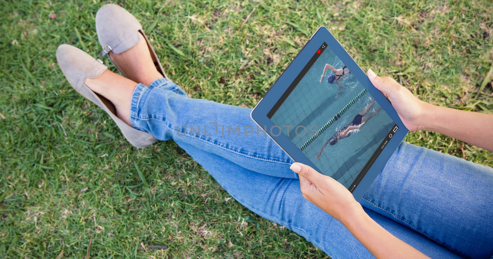 View of lecture app against woman using tablet in park