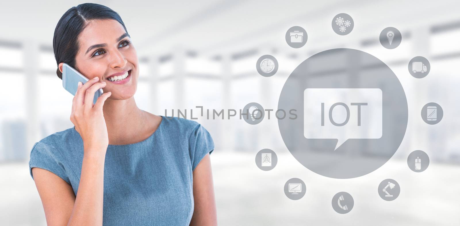 Composite image of beautiful businesswoman using mobile phone by Wavebreakmedia