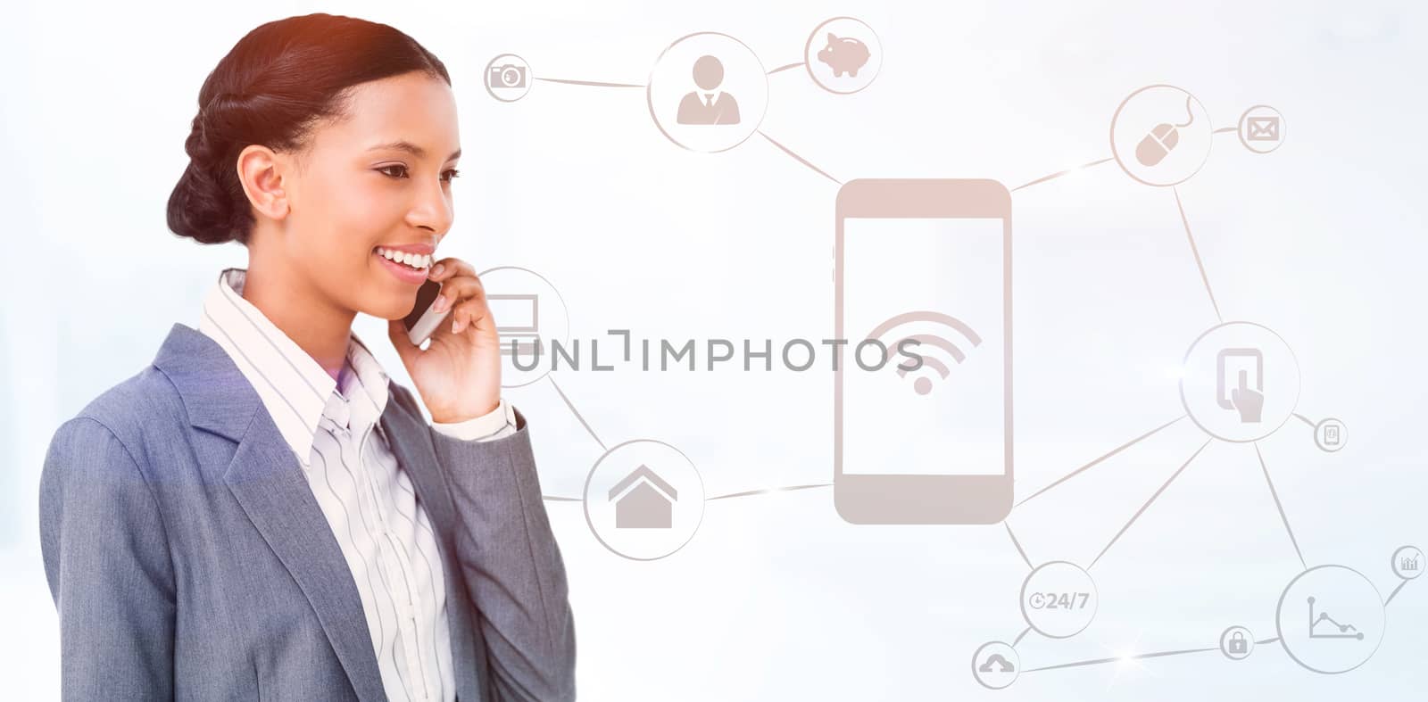 Smiling businesswoman using mobile phone against modern room overlooking city