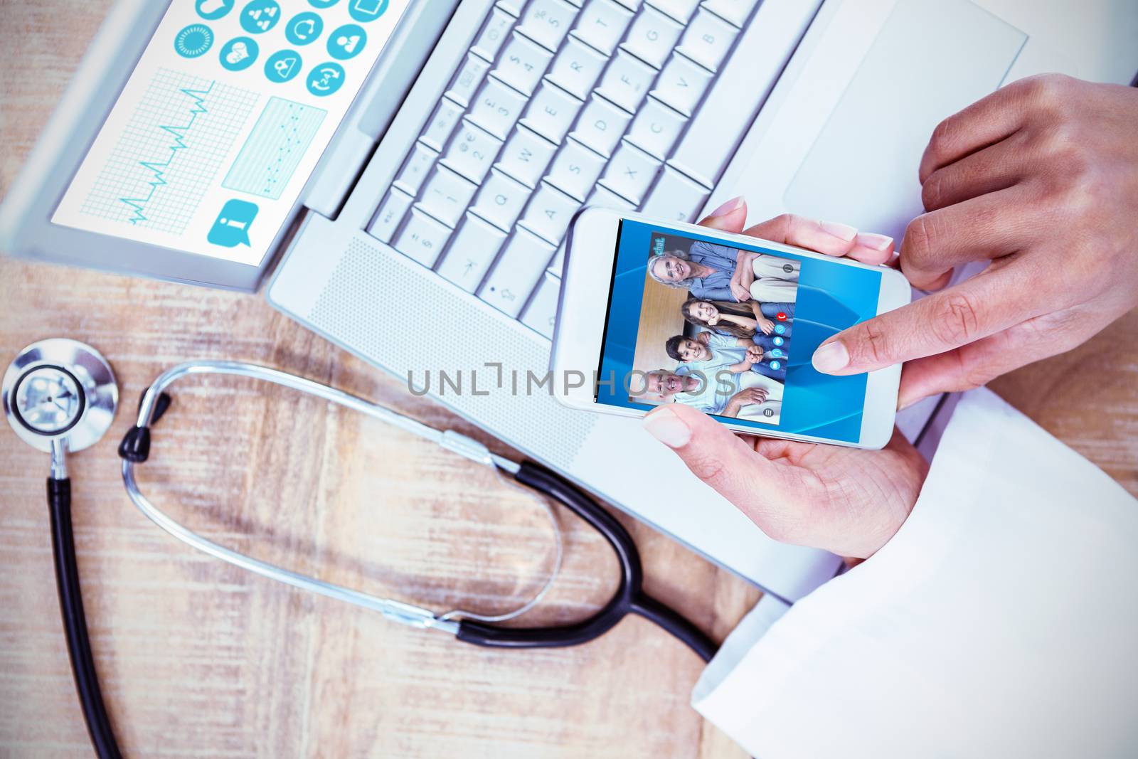 View of video chat app against doctor using smartphone on wooden desk 