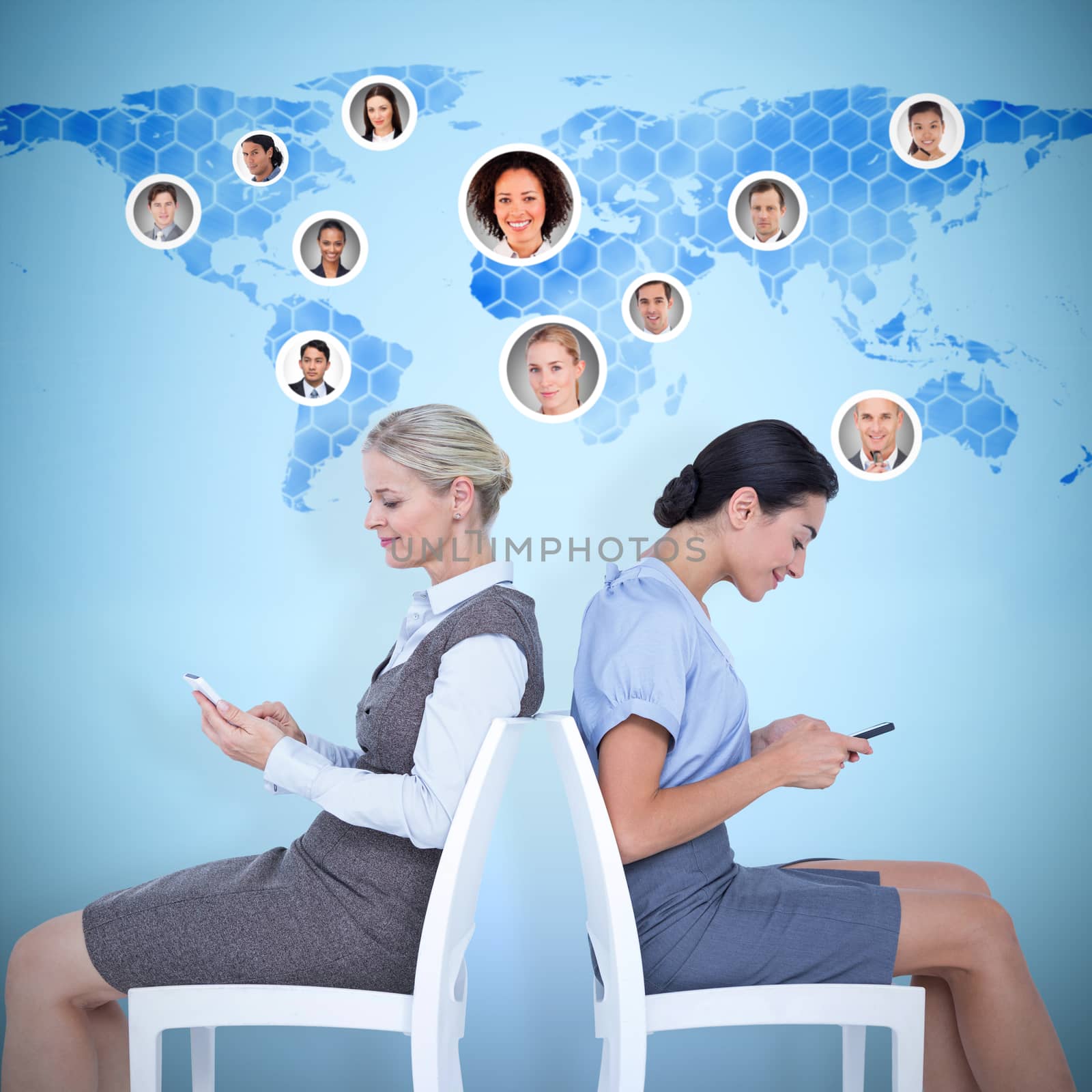 Composite image of businesswomen sitting back-to-back on the chairs by Wavebreakmedia