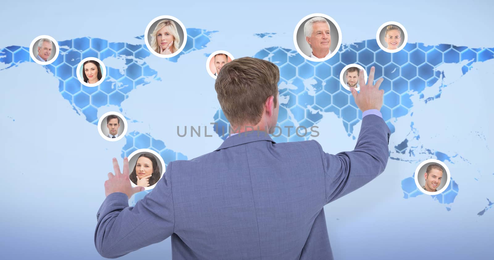 Back turned businessman gesturing with hands against background with hexagons and world map