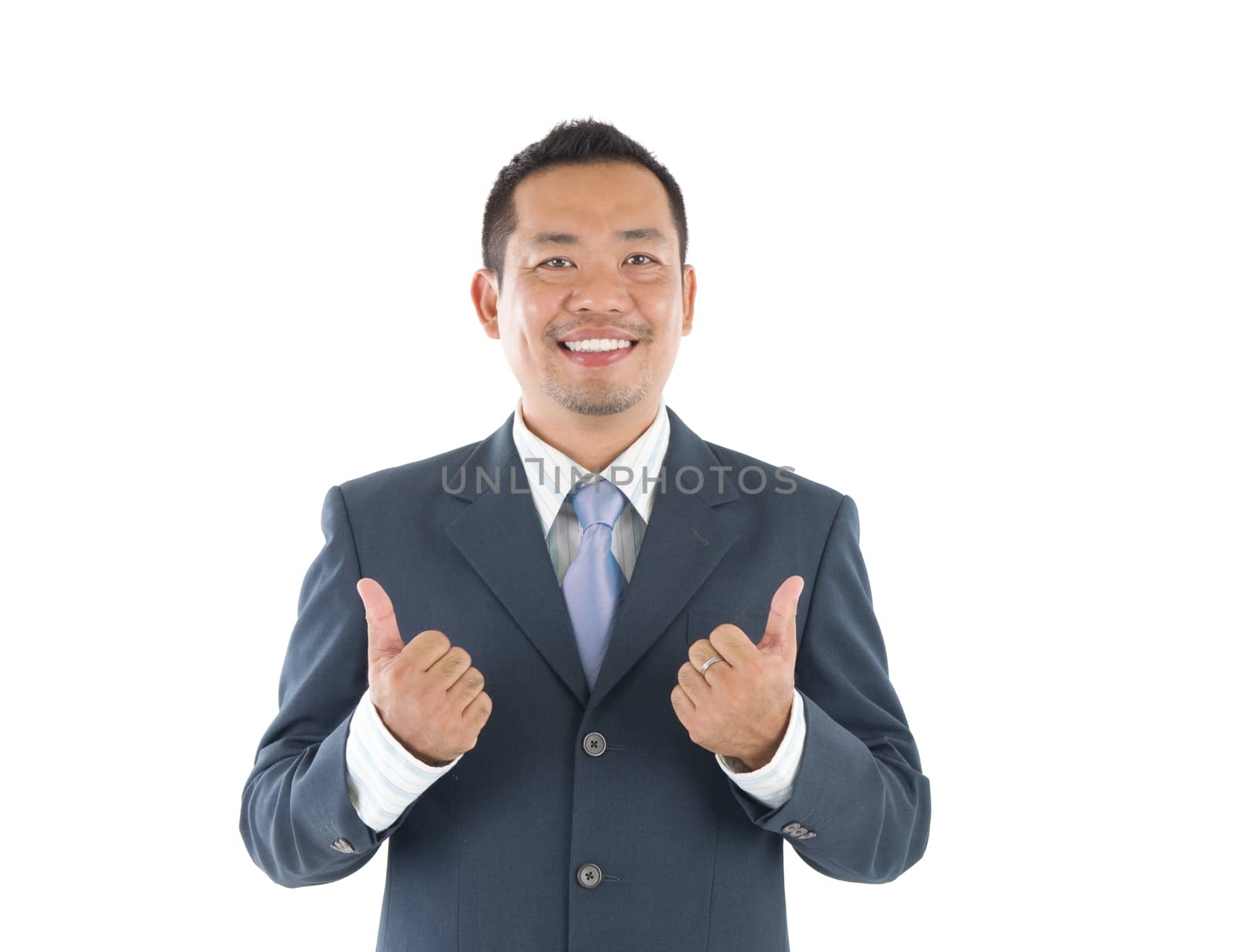 Thumbs up 40s indonesian businessman giving thumbs up over white background