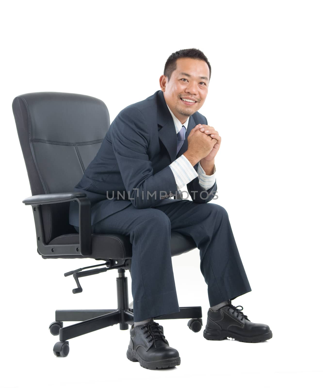 Full body Asian business man seated on chair, arms crossed isolated on white background. 