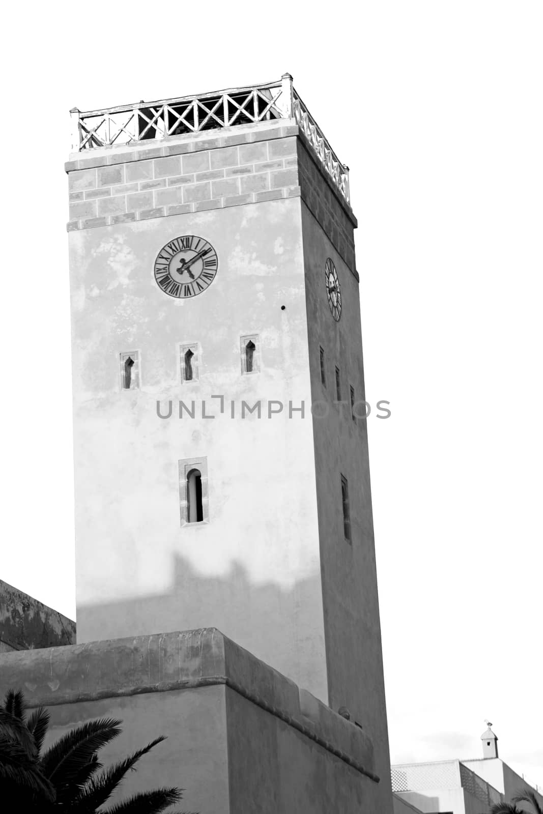 old brick tower in morocco africa village and the sky