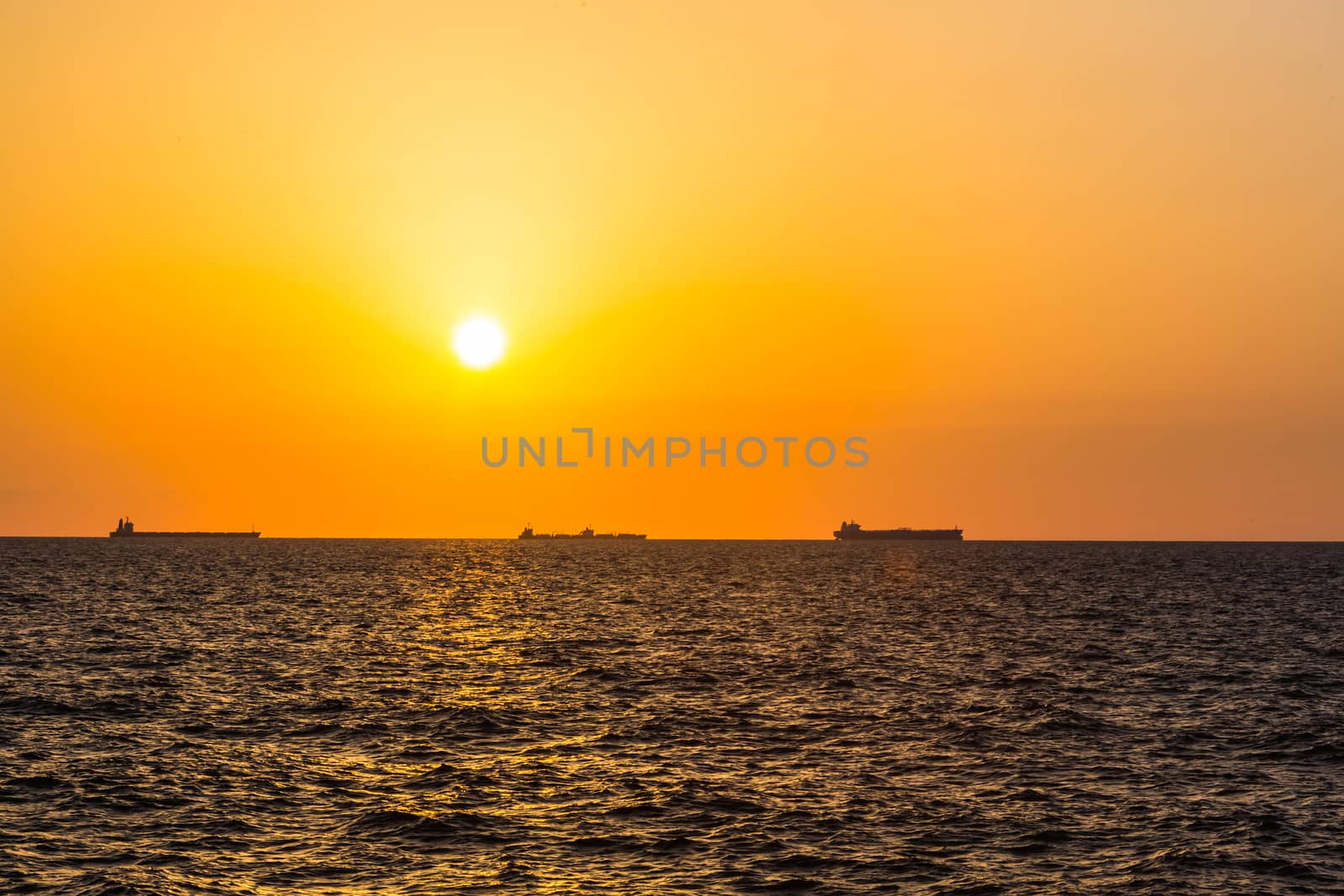 maritime landscape, large ships on sunset background