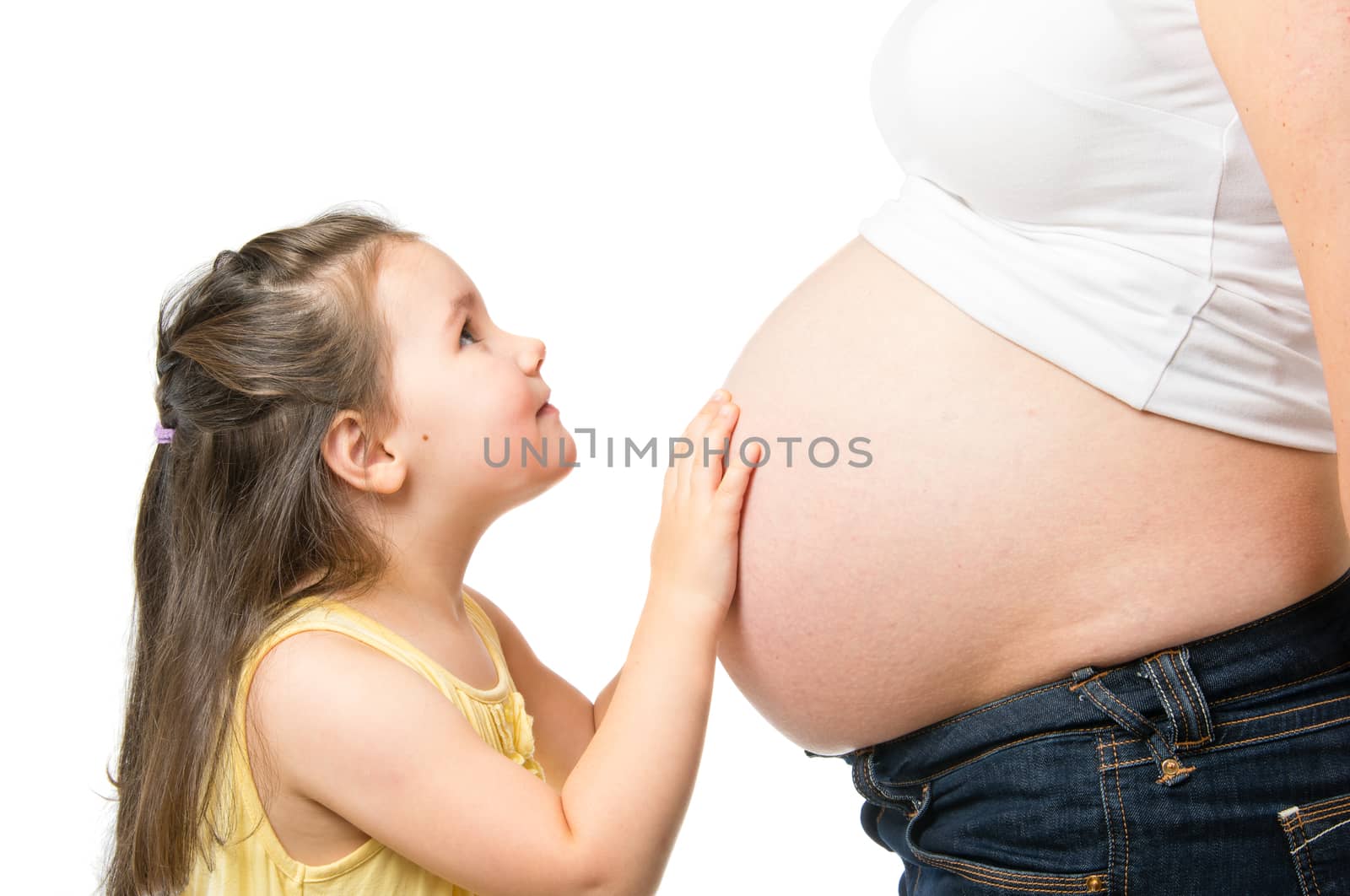 Little girl and pregnant mother isolated on white