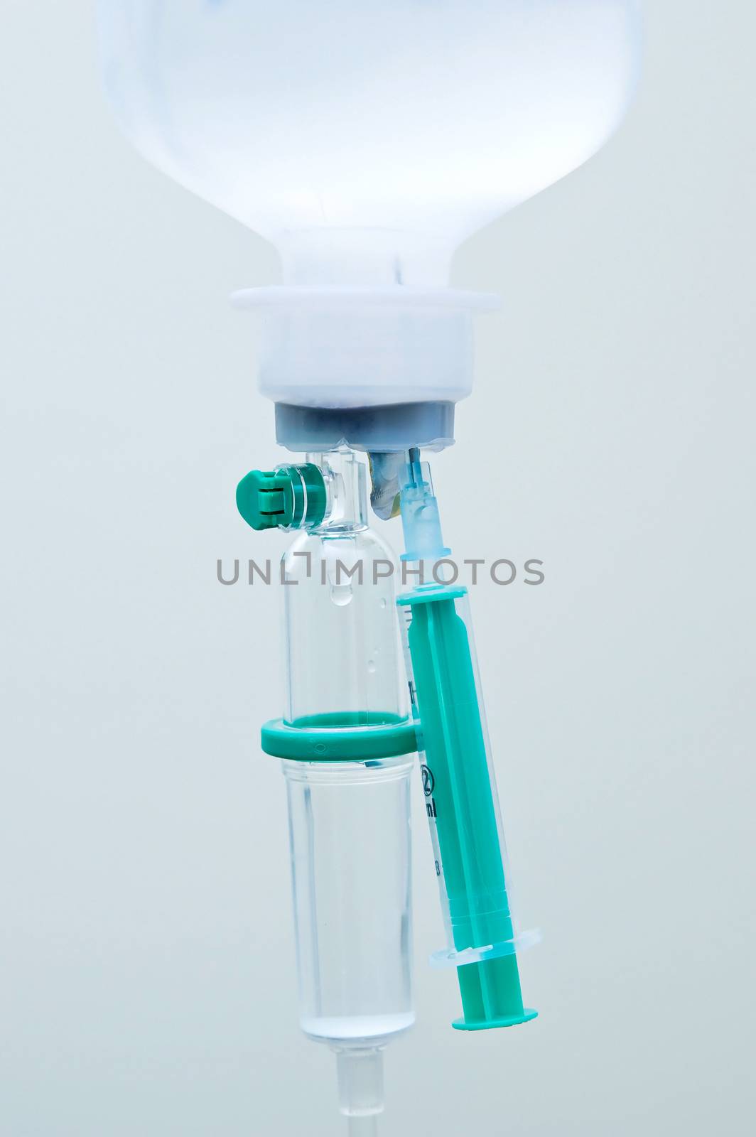 Infusion bottle and syringe close up