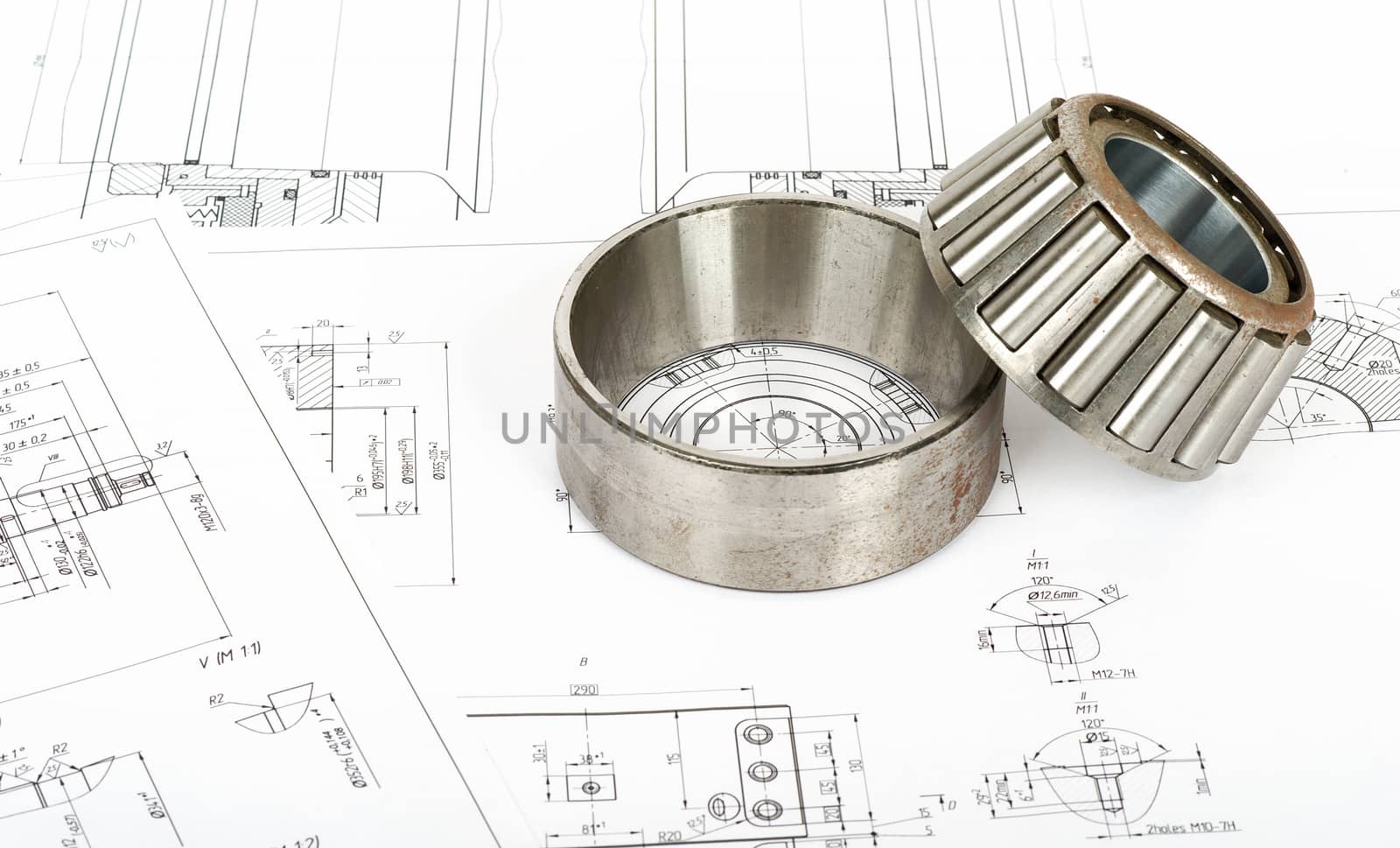 Roller bearing on blue prints, top view