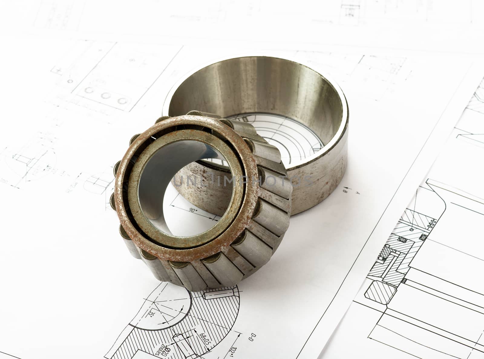 Roller bearing on blue prints, side view