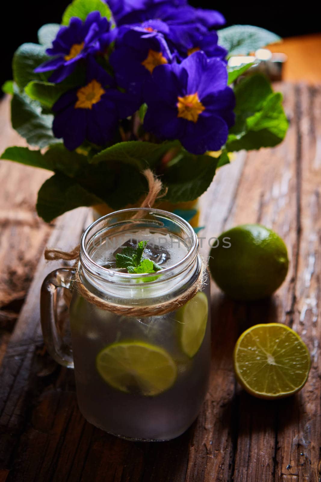 fresh mojito on a rustic table. Shallow dof