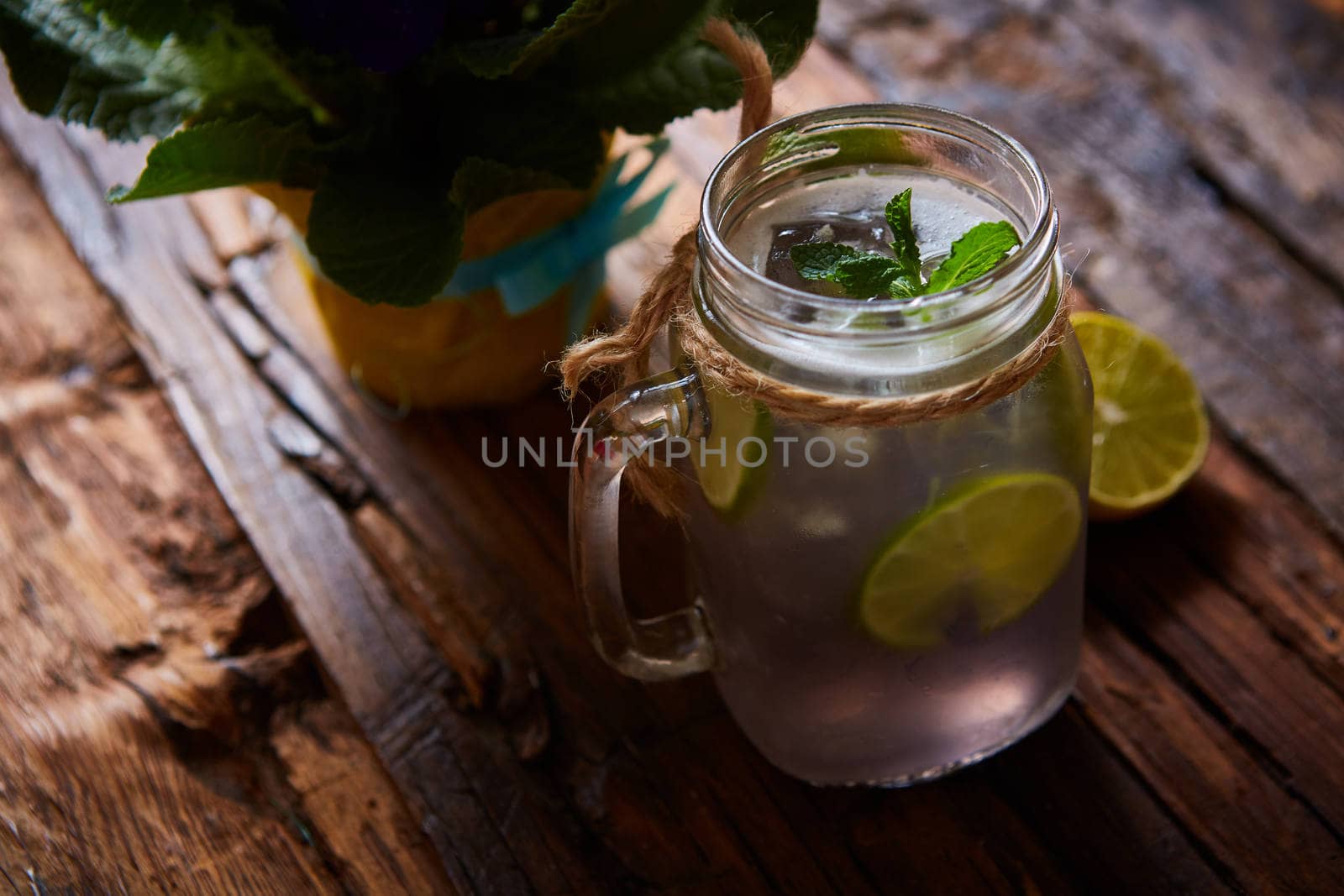 fresh mojito on a rustic table. Shallow dof