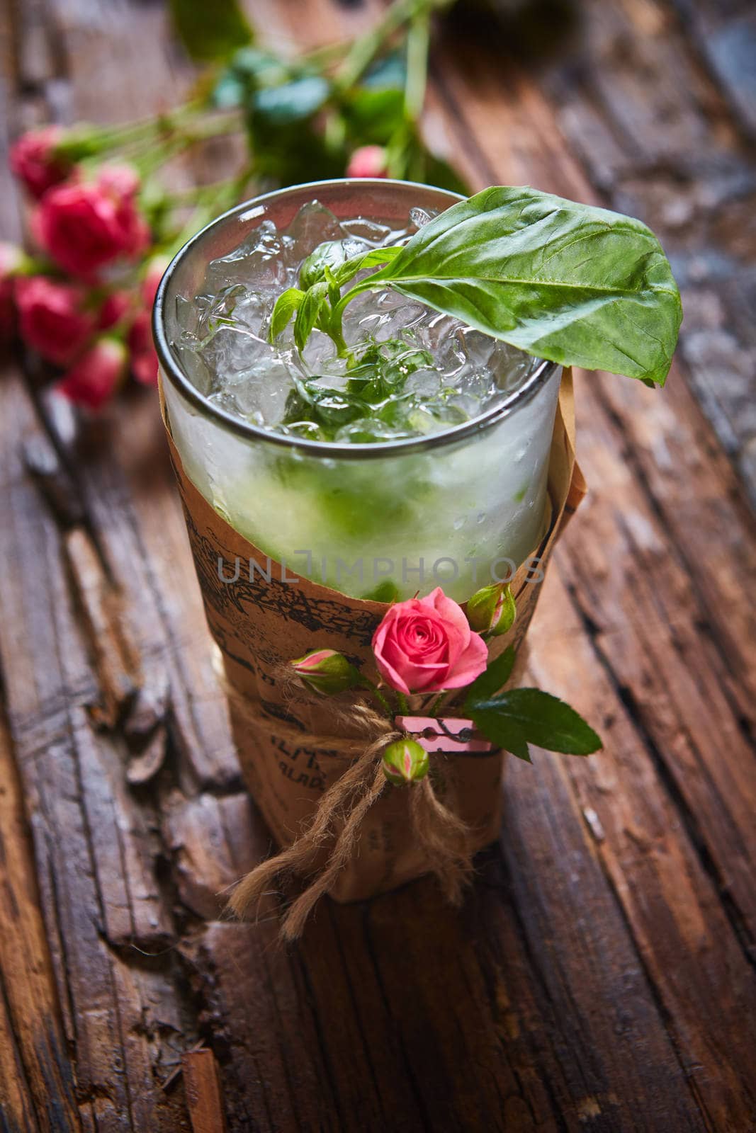 fresh mojito on a rustic table by sarymsakov