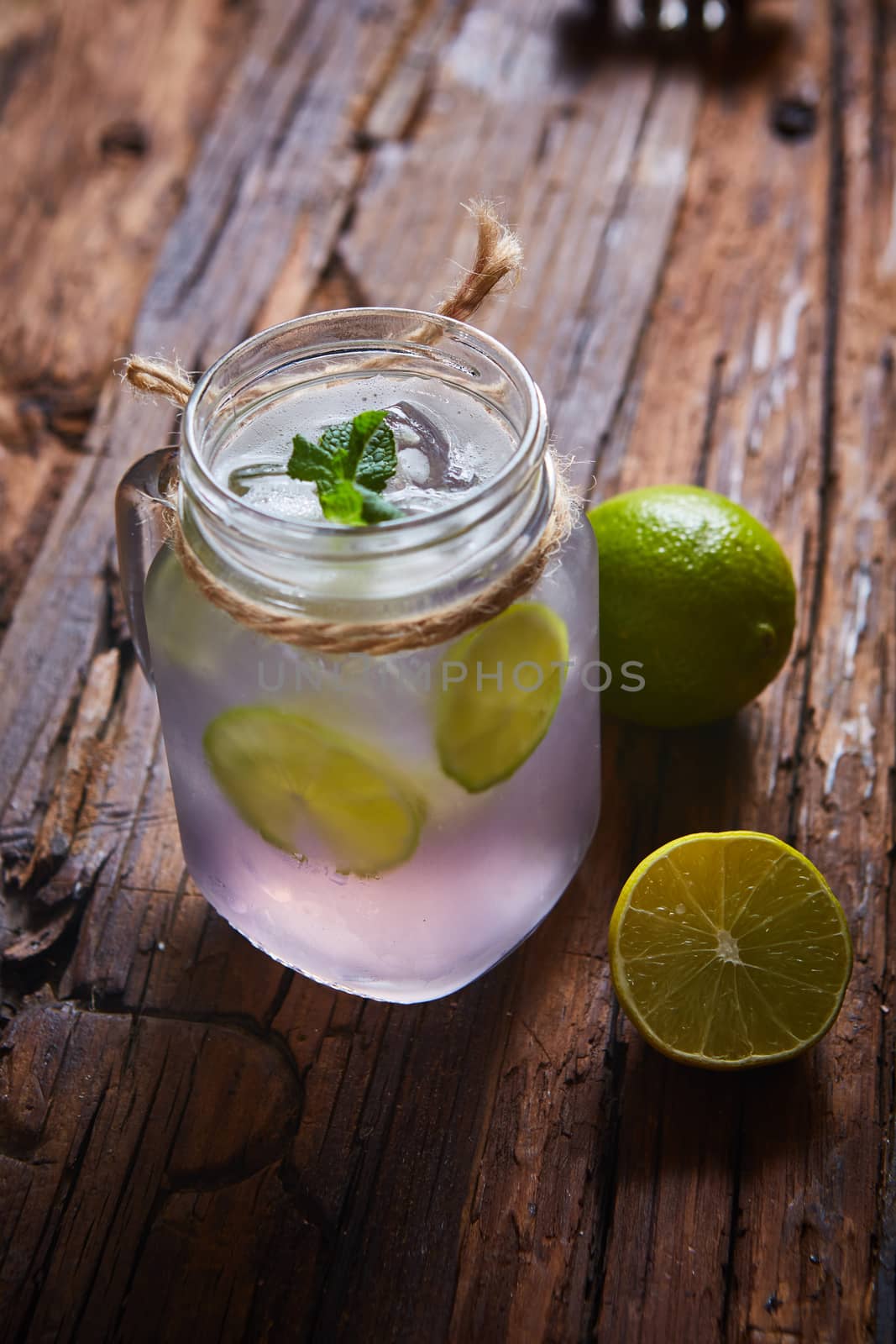 fresh mojito on a rustic table. Shallow dof