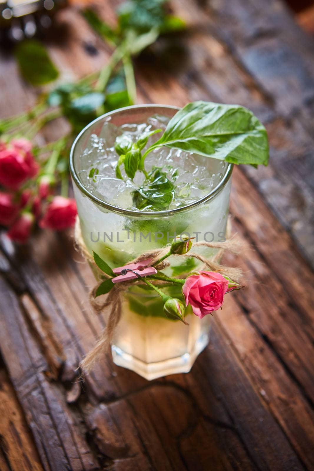 fresh mojito on a rustic table by sarymsakov