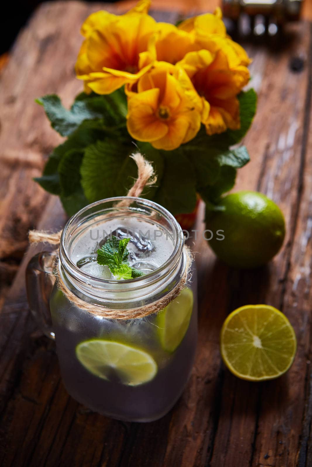 fresh mojito on a rustic table. Shallow dof