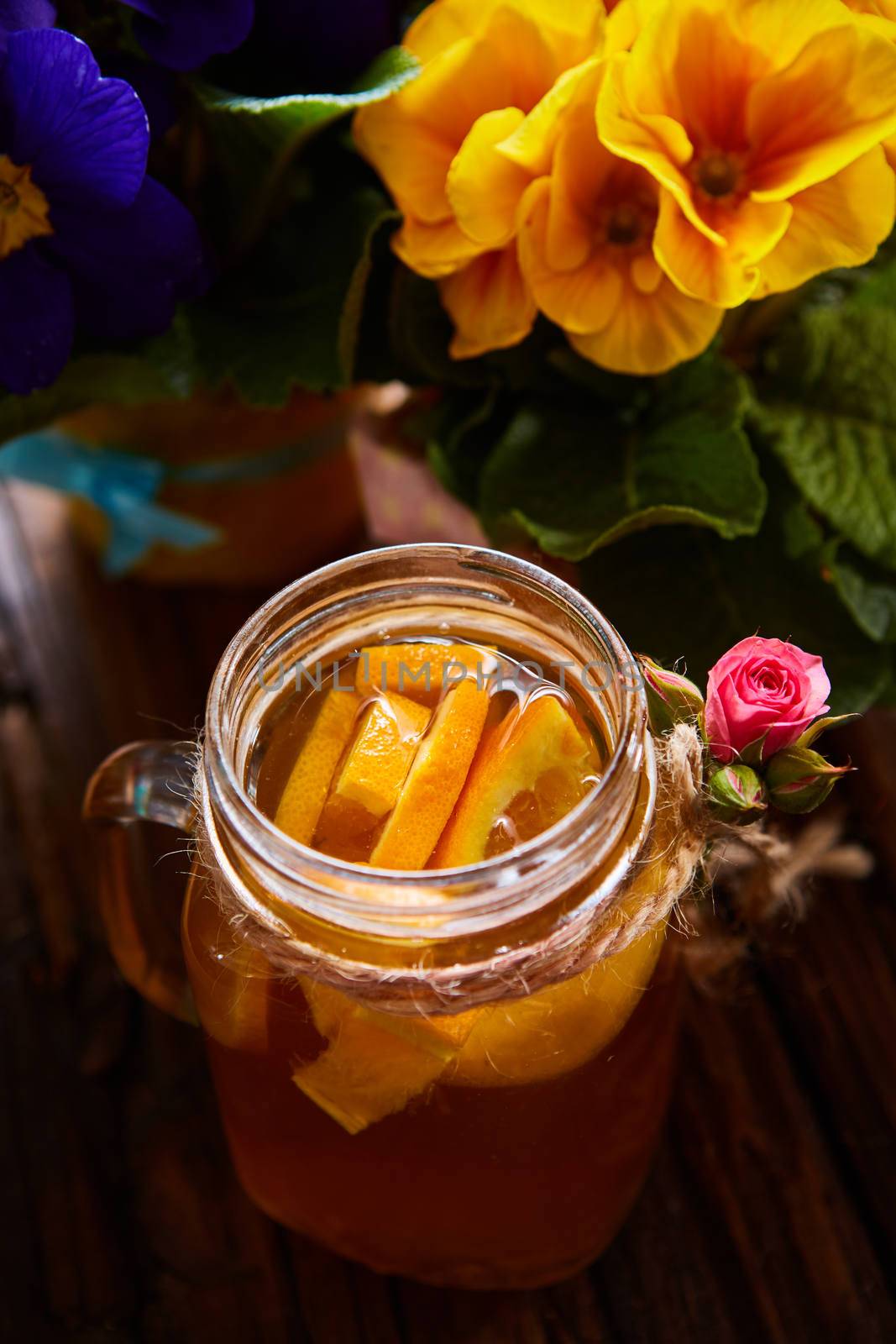 Ginger tea with orange, spices and honey. Shallow dof