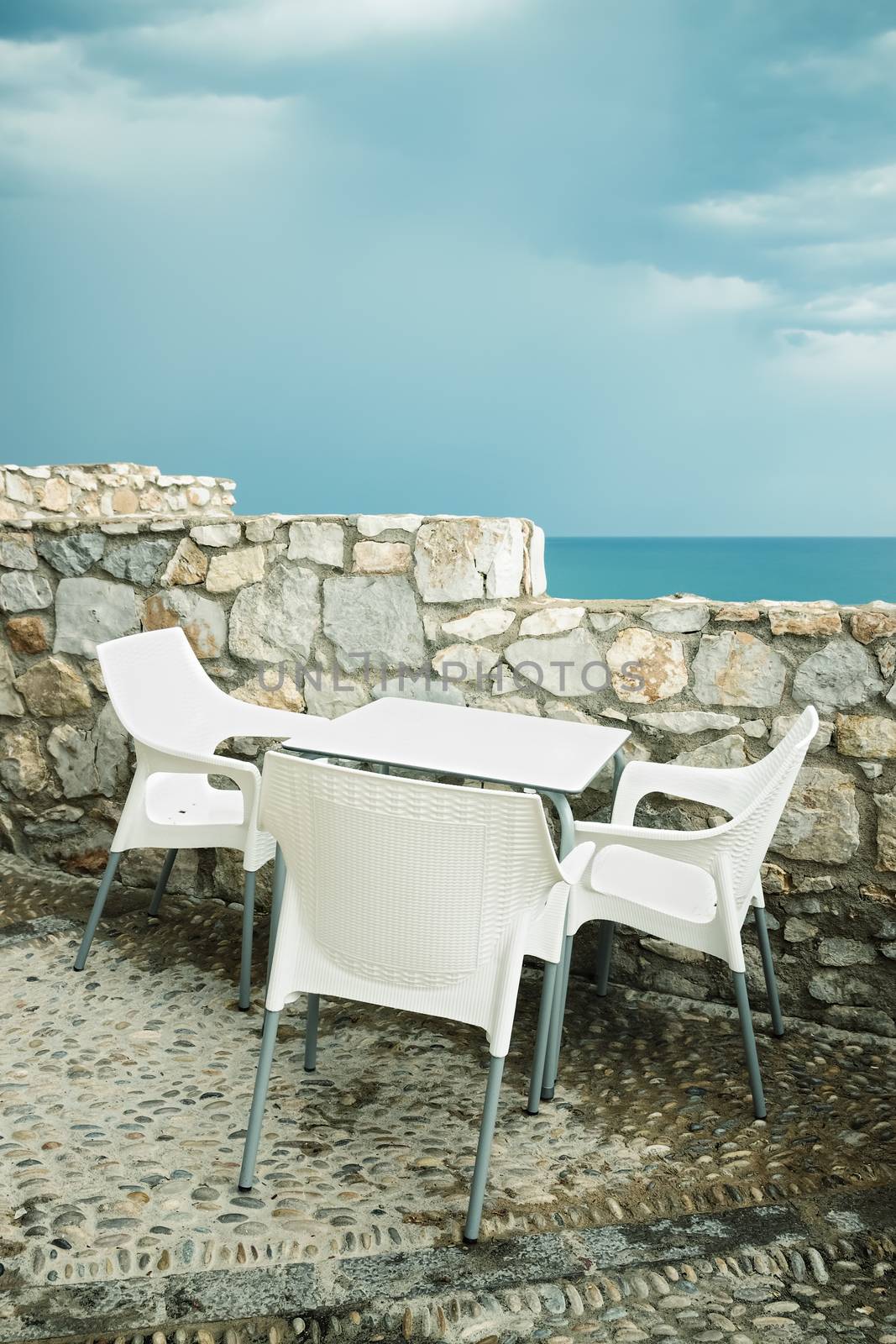 Outdoor cafe by the seaside. Peniscola, resort in the province of Castellon, Valencian Community, Spain.