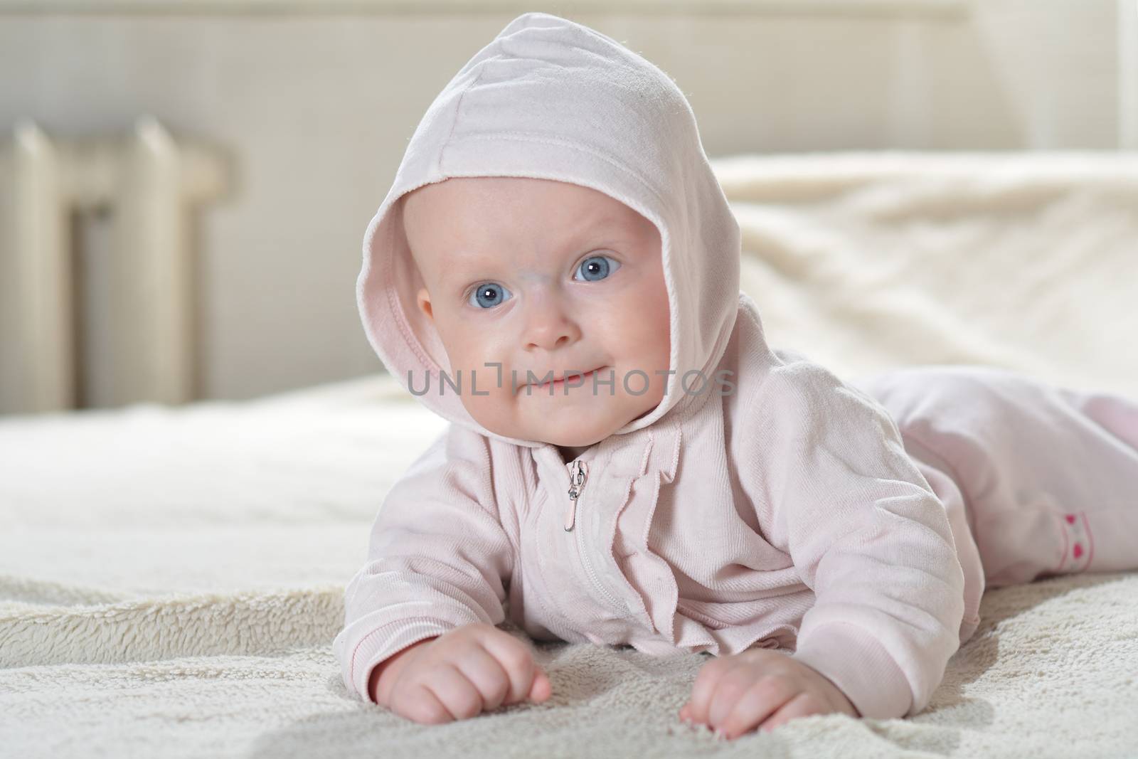 Bathroom textile for babies and children beautiful happy baby after bath look at the camera