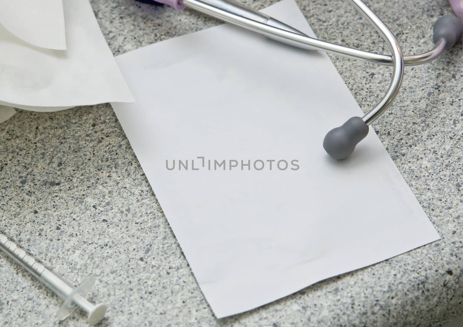 Stethoscope and blank paper for notes