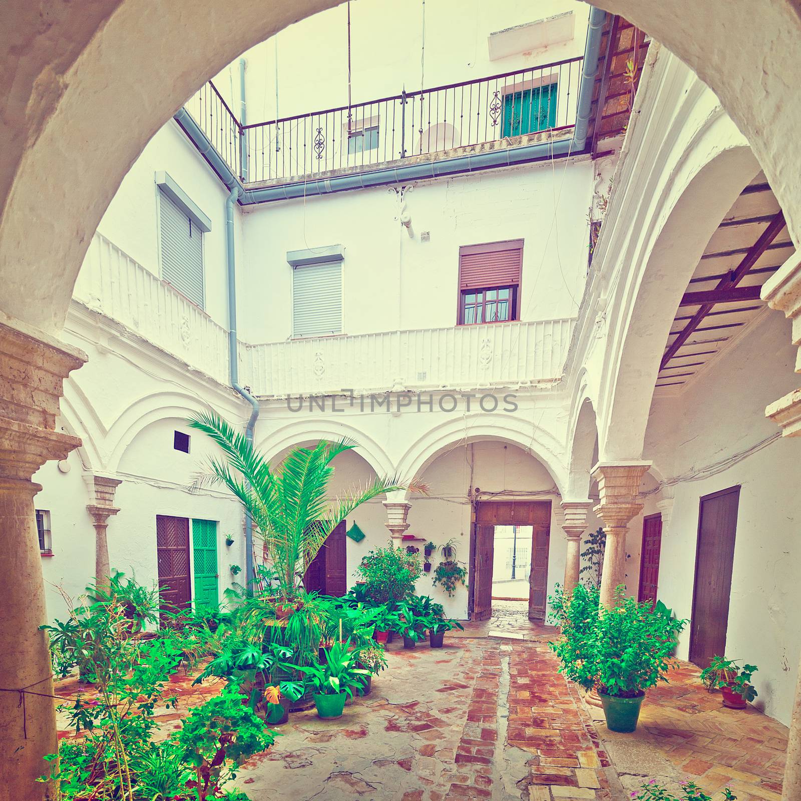 Patio in the Spanish House Decorated with Flowers, Vintage Style Toned Picture