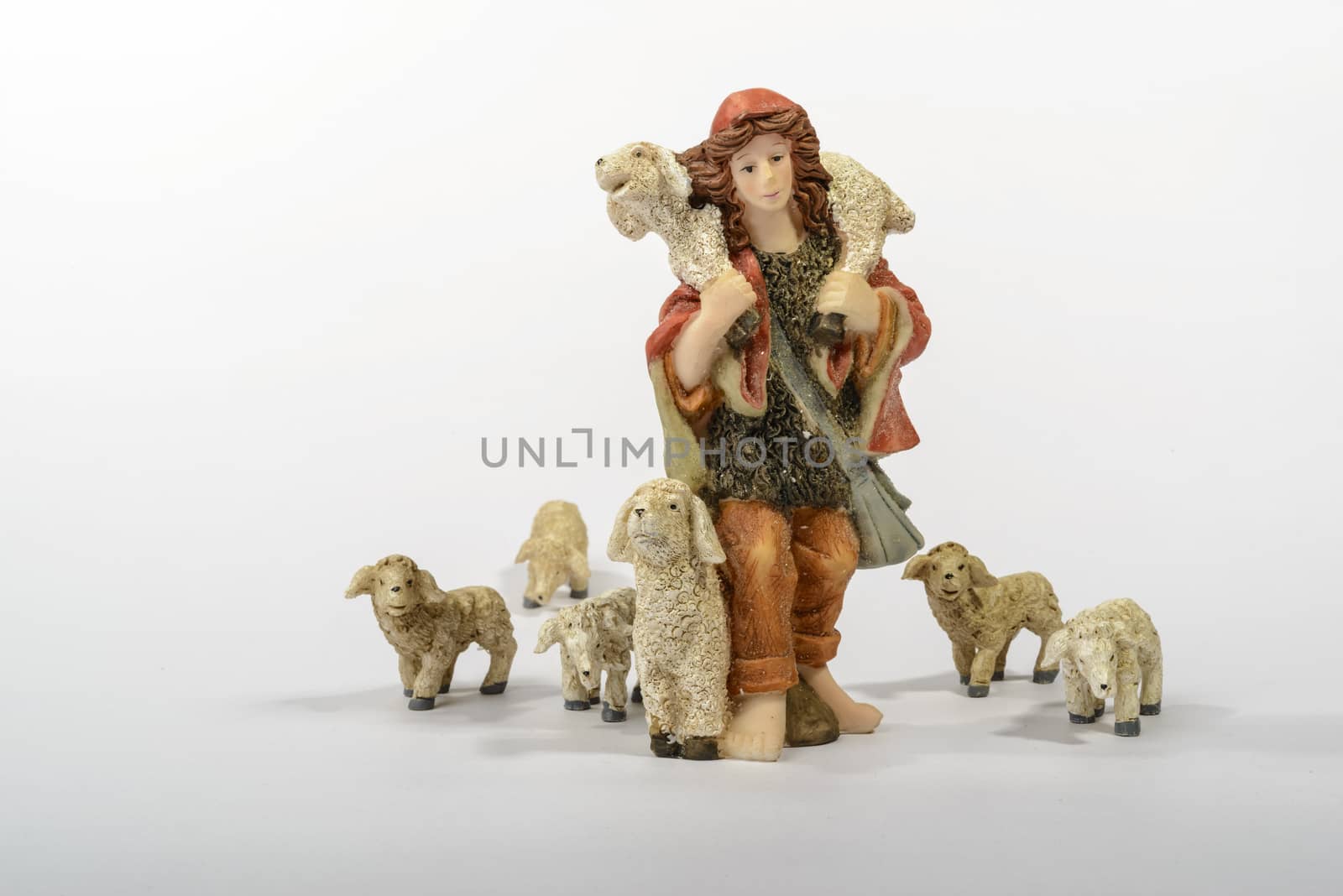 Shepherd with his sheep, element of the Christmas nativity. White background.