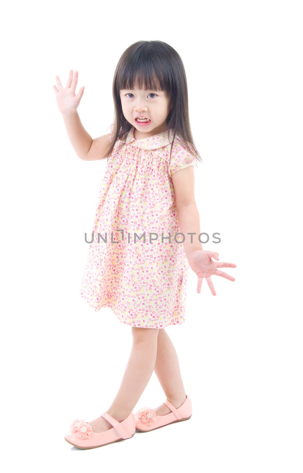 Little asian girl posing isolated on white background