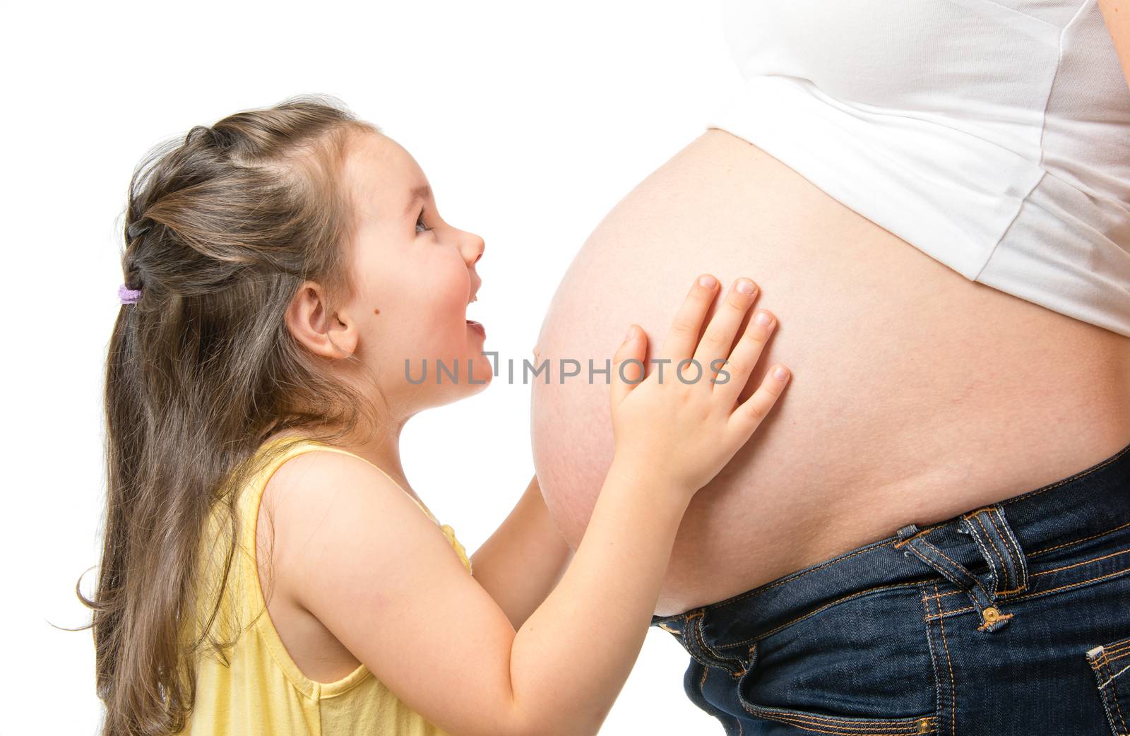 Happy little girl with pregnant mother isolated on white