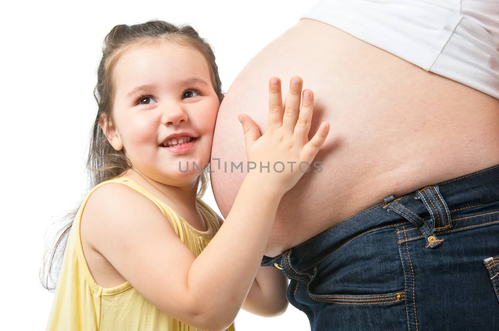 Little girl with pregnant mother isolated on white