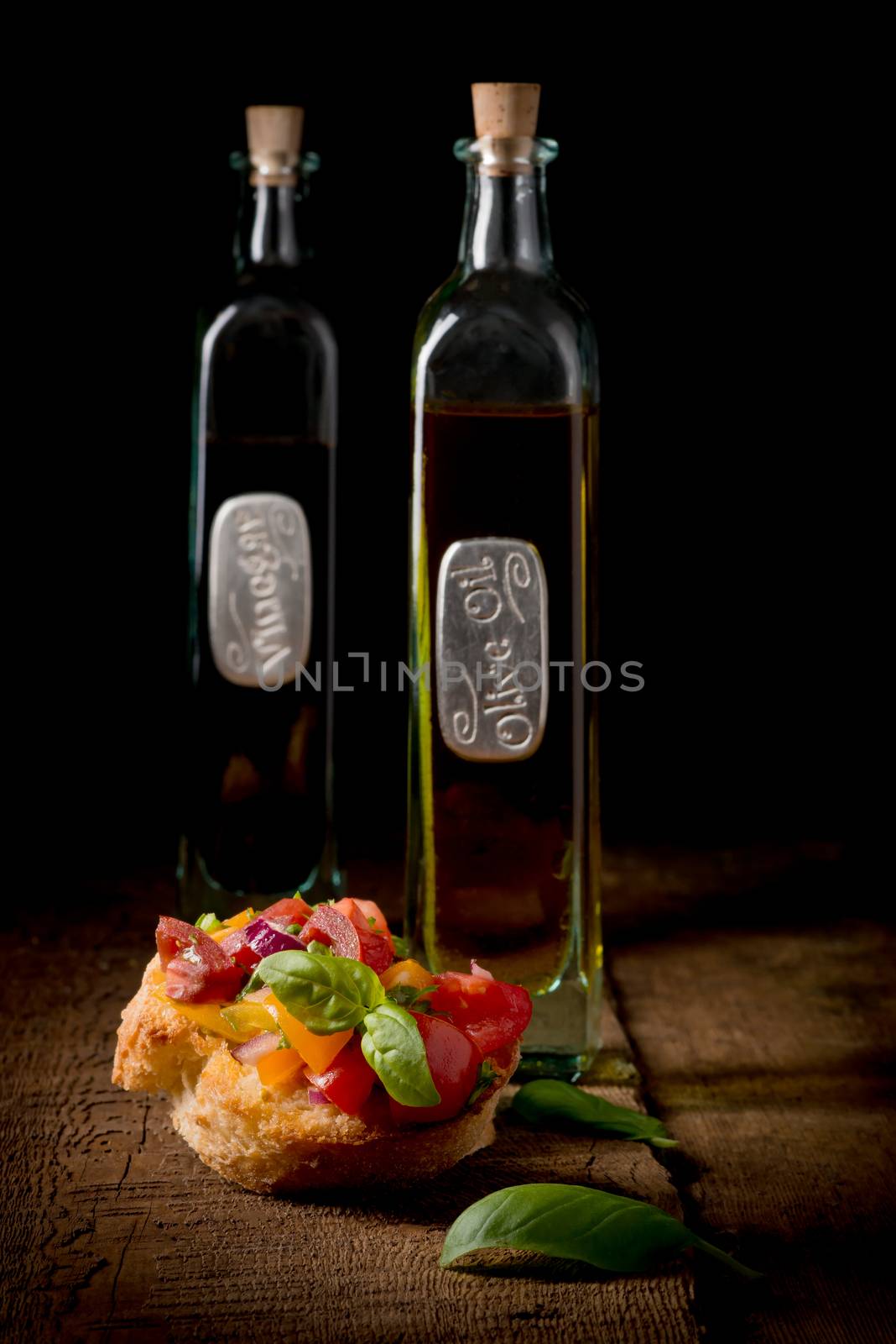 Colorful bruschetta appetizer on a low key background suitable for many food service promotions.