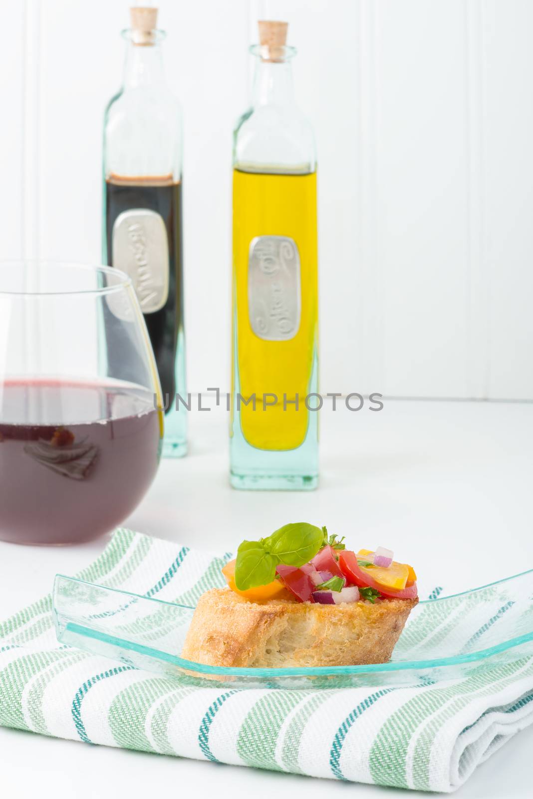 Colorful bruschetta on a glass plate.  Useful for many food service promotional applications.