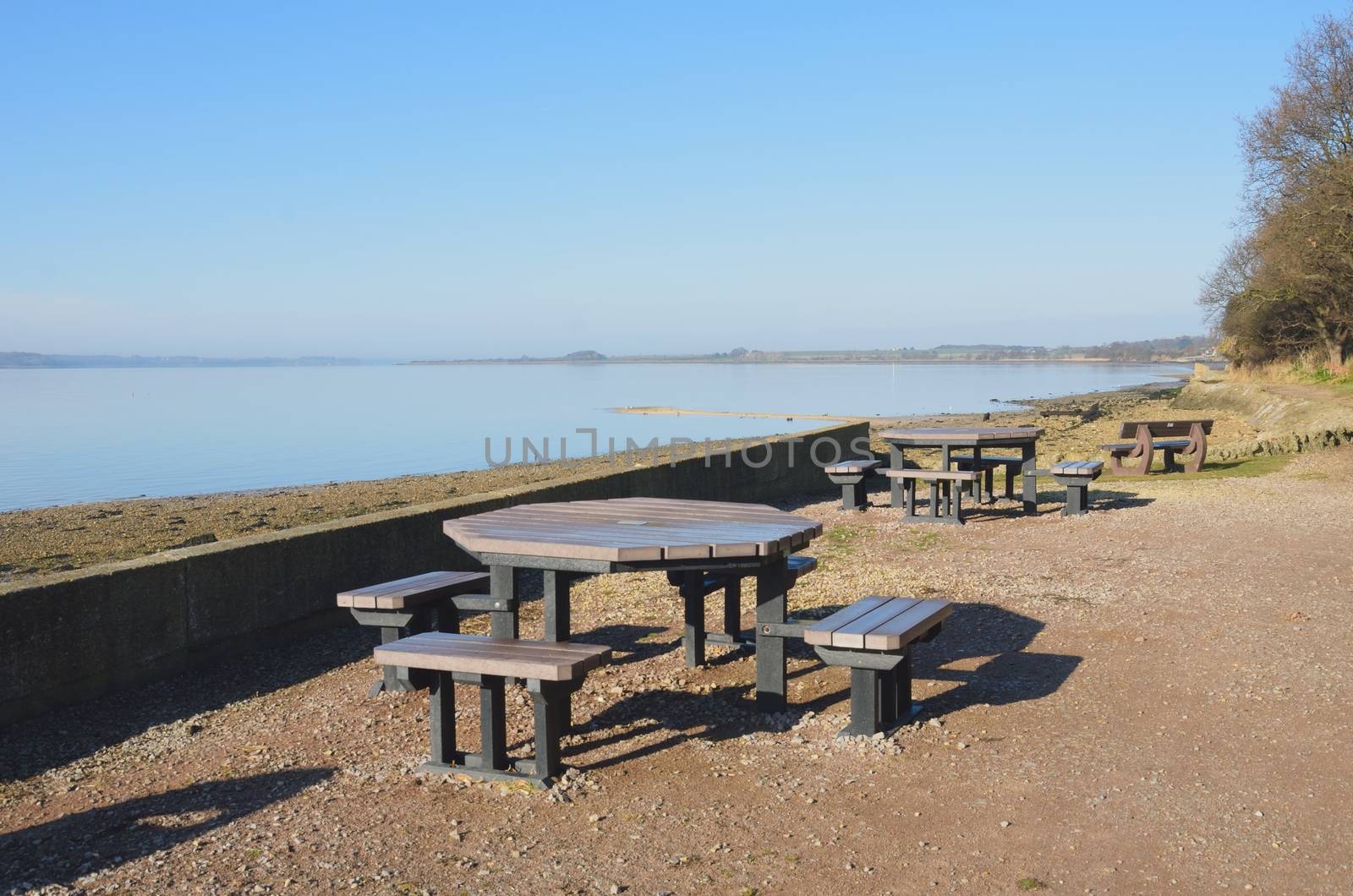 Picnic tables by estuary by pauws99