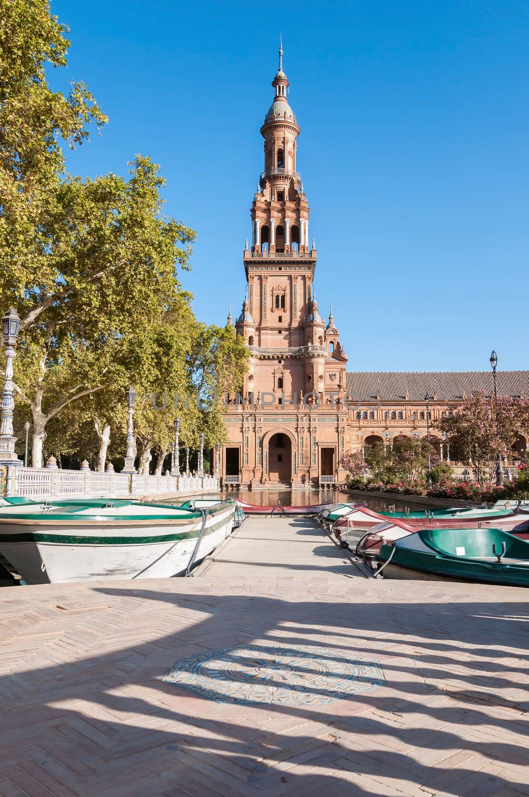 Boats at the tower of the Plaza de Espana in Seville