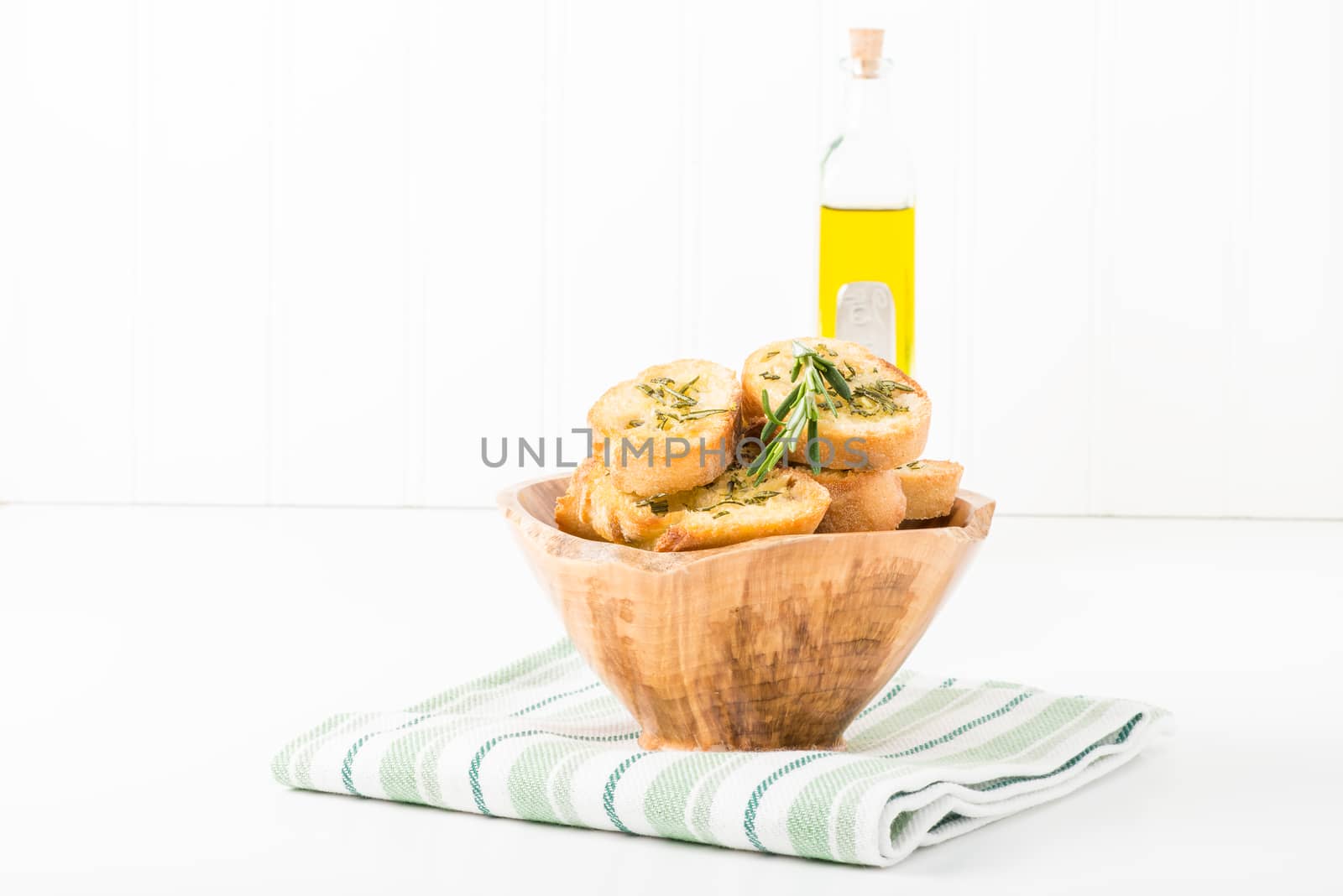 Bowl of rosemary and olive oil crostini.  Useful for many food service marketing applications.