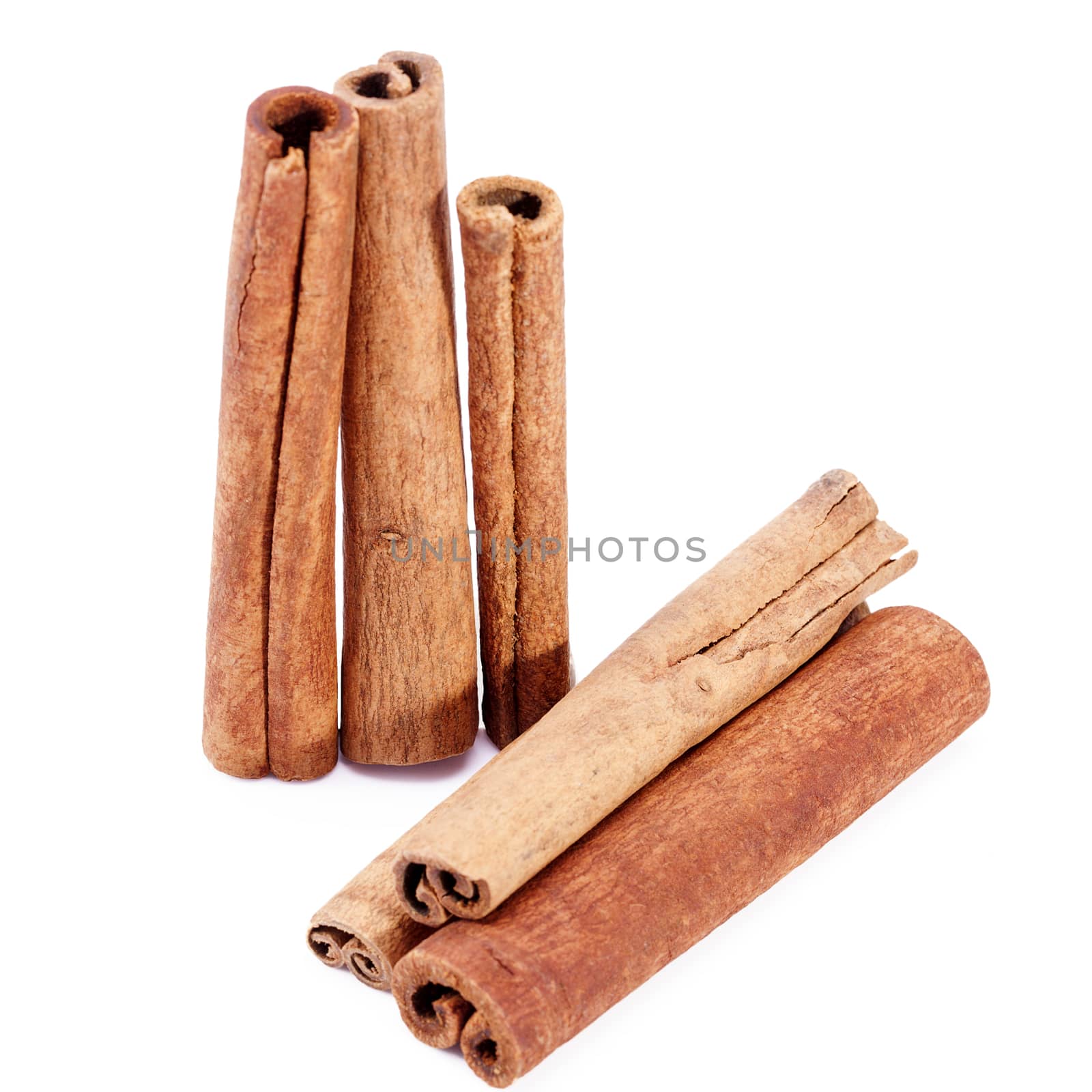 group of dried cinnamon stics isolated on white background.
